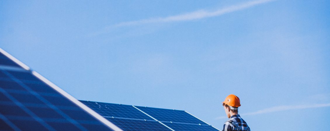man-worker-in-the-firld-by-the-solar-panels