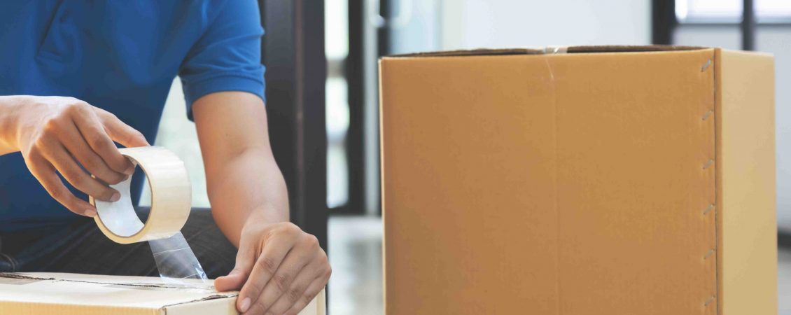 small-online-business-owner-packing-in-the-cardbox