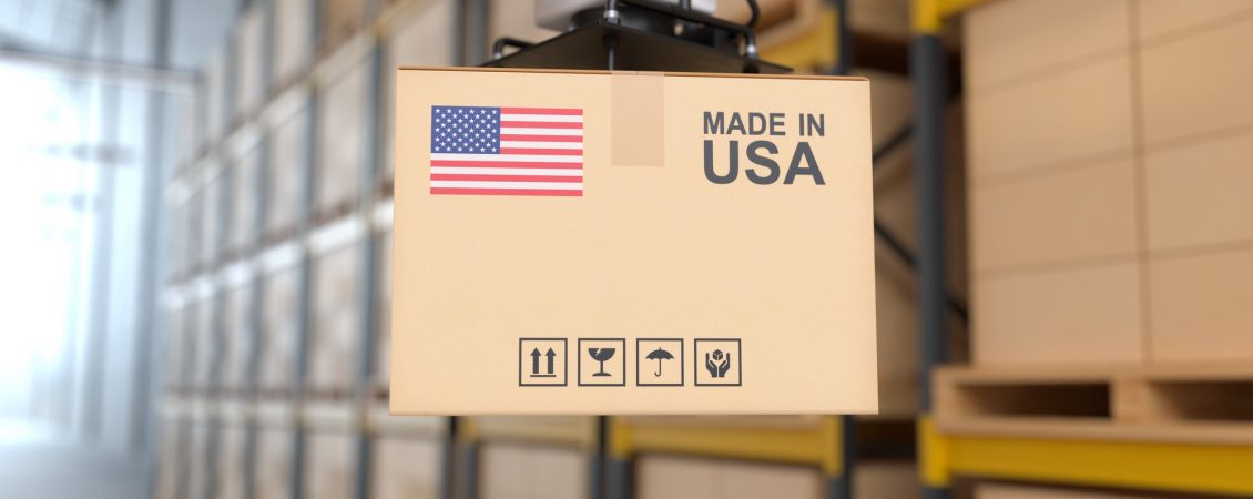 the-robot-arm-picks-up-the-cardboard-box-made-in-usa-automation-robot-arm-in-the-storehouse