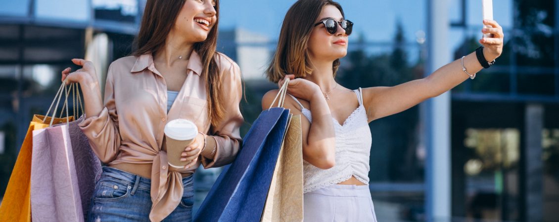 two-beautiful-women-shopping-in-town
